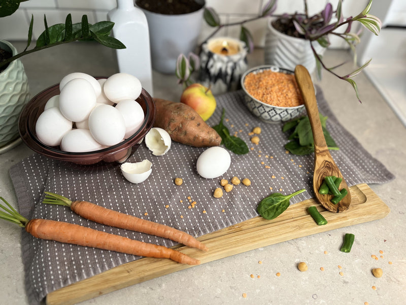 Variety of vegetarian ingredients on a wooden cutting board