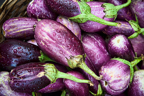 Lots of raw eggplants