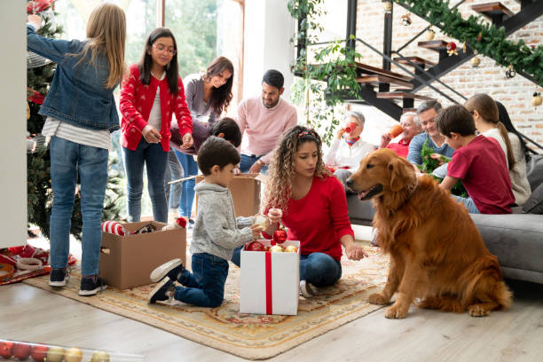 Dog socializing with its family around a christmas tree